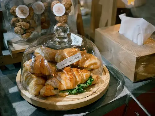 A vase full of croissants with meat